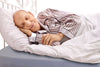 Man sleeping on therapeutic memory foam bed-wetter